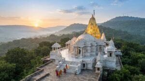 Ambaji Temple in Gujarat at dawn, its marble walls and golden spire catching the light