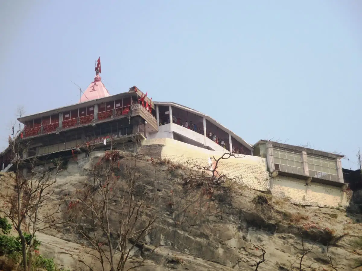 Chandi Devi temple building with red shikhara on a rocky ridge above Haridwar