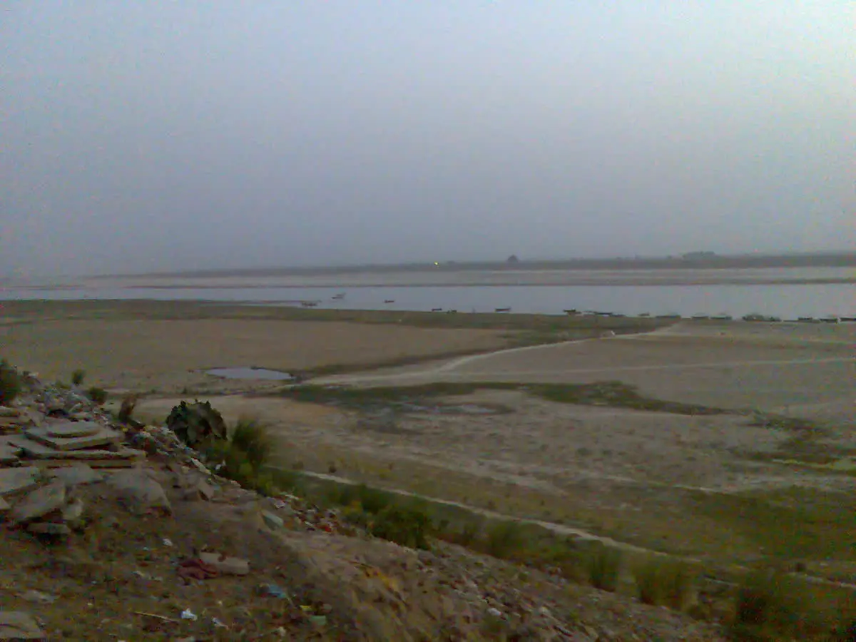 Wide sandy bank and broad channel of the Ganga seen from the rocky ground at Vindhyachal