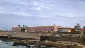 Red and white striped outer wall of the Kumari Amman temple above the Kanyakumari shore