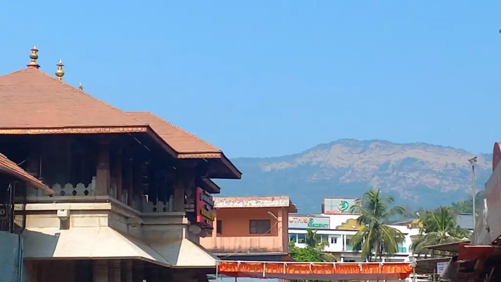 Tiled roofs of the Mookambika temple at Kollur with Western Ghats hills behind
