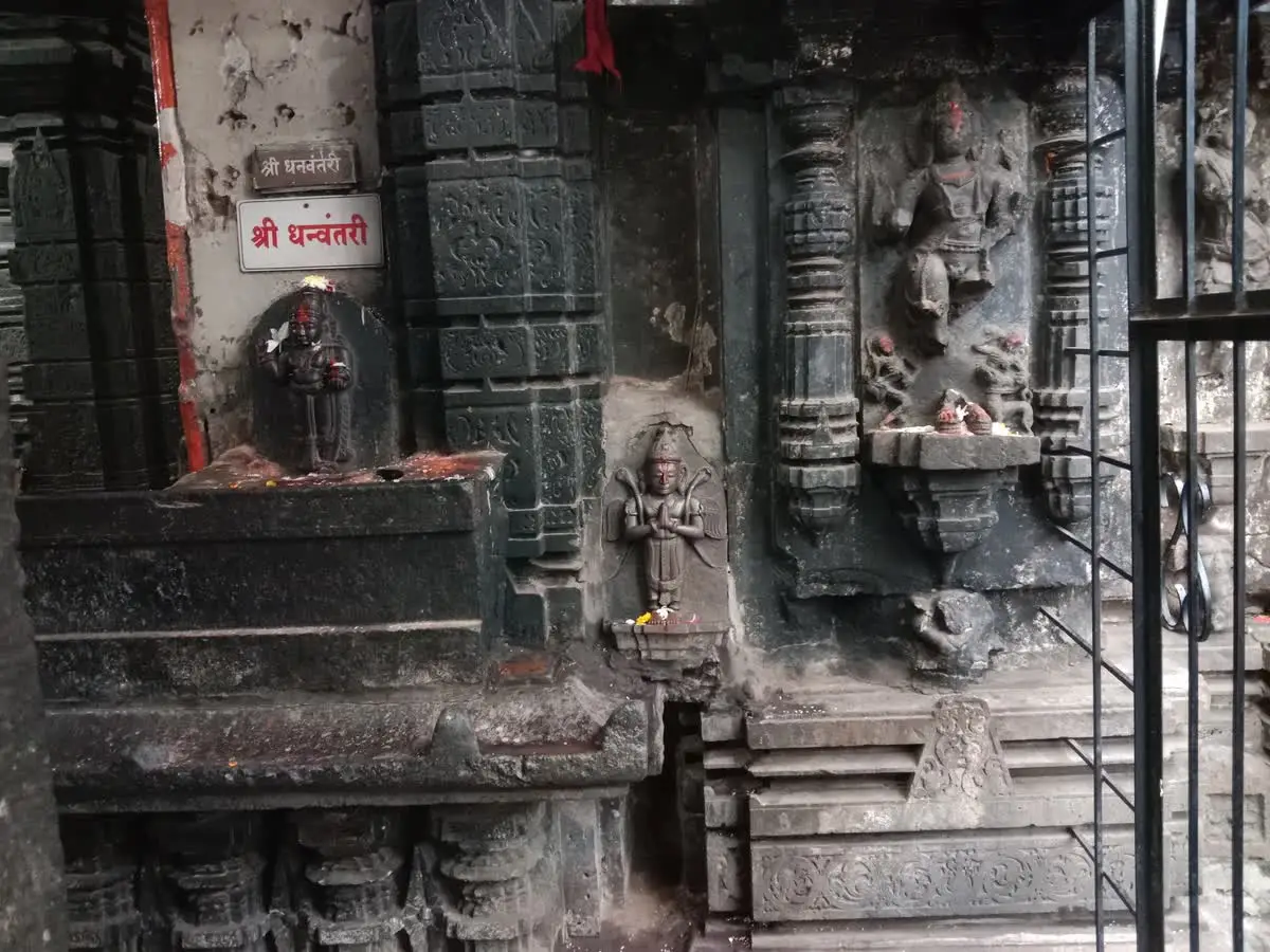 Carved black stone walls and sculptures of the Mahalakshmi temple in Kolhapur