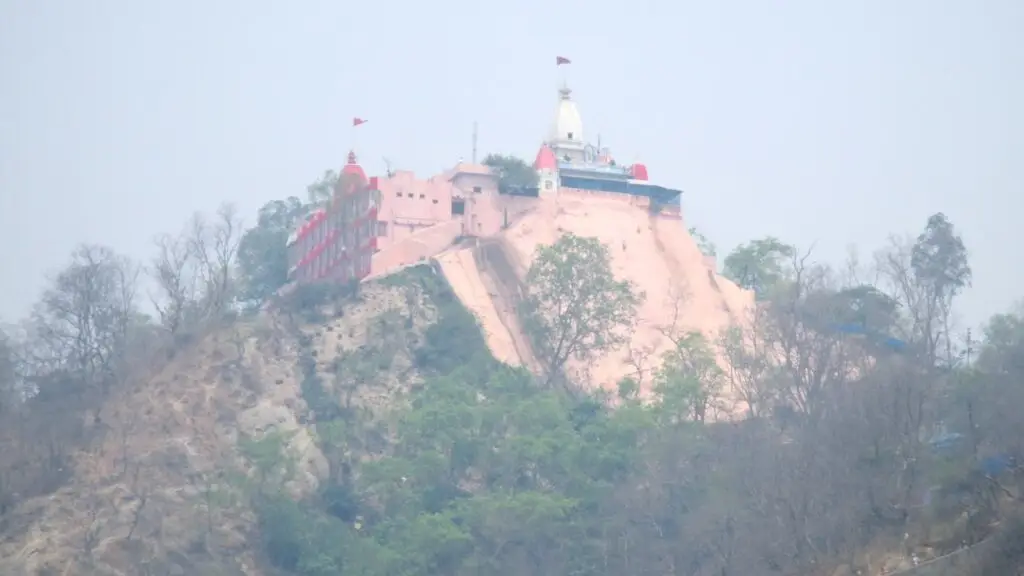 Pink Mansa Devi temple perched on Bilwa Parvat hilltop above Haridwar in haze