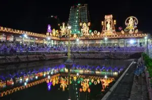 Golden Lotus tank and gopuram lit with festival lights during Navaratri at Meenakshi Amman temple