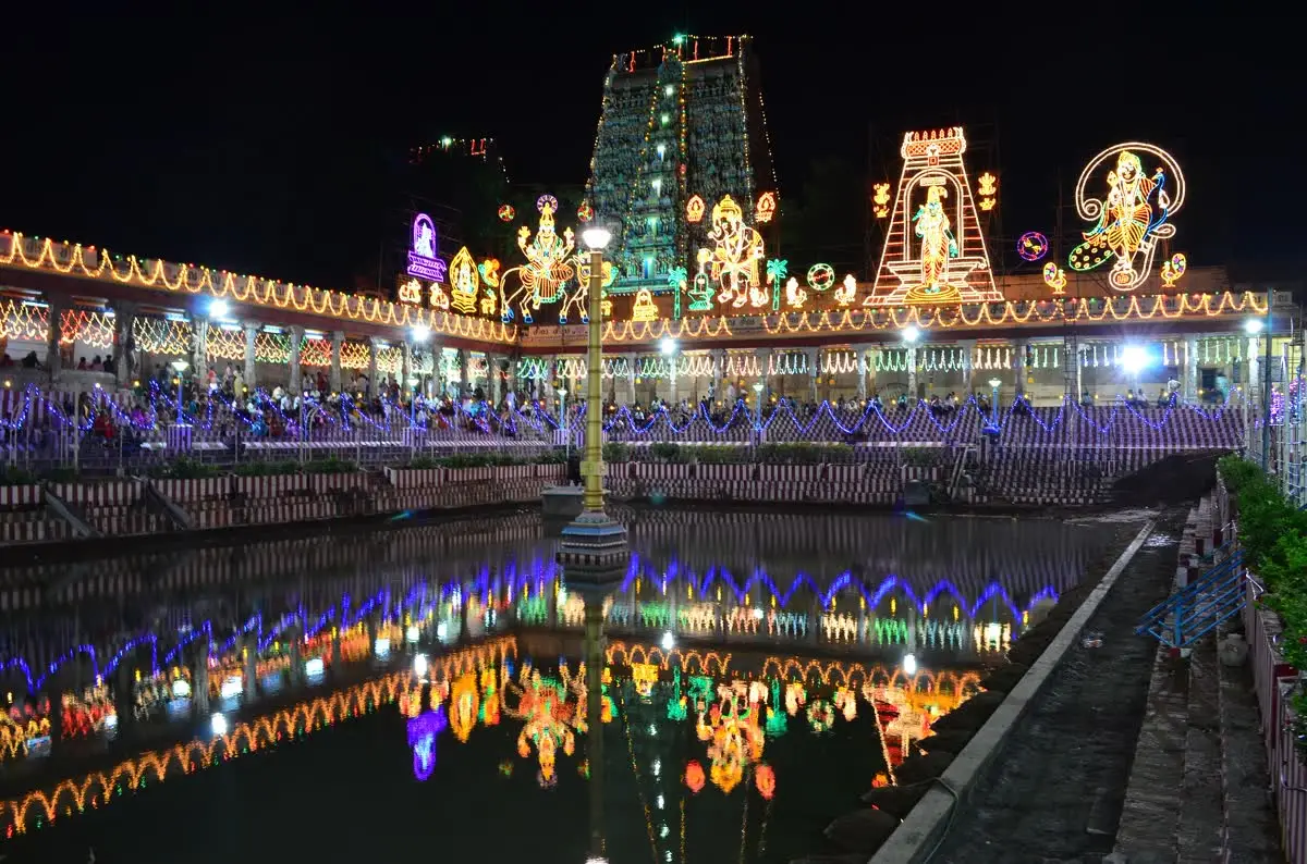 Golden Lotus tank and gopuram lit with festival lights during Navaratri at Meenakshi Amman temple
